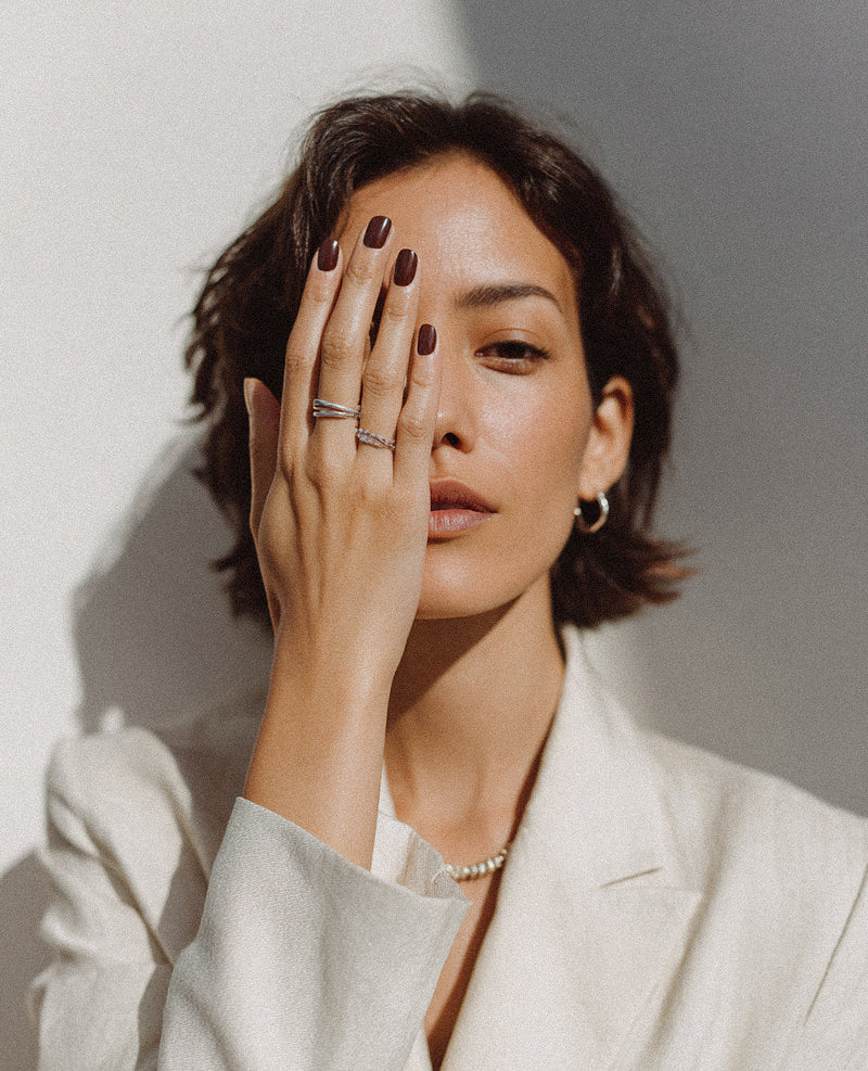 Editorial image of woman with hand over face for The Pink Journal's Facials File.